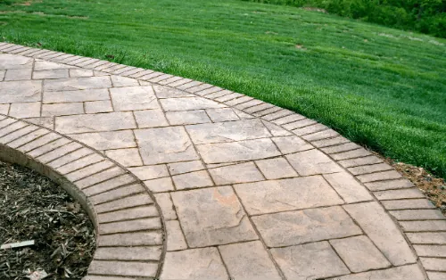 Curved stamped concrete walkway
