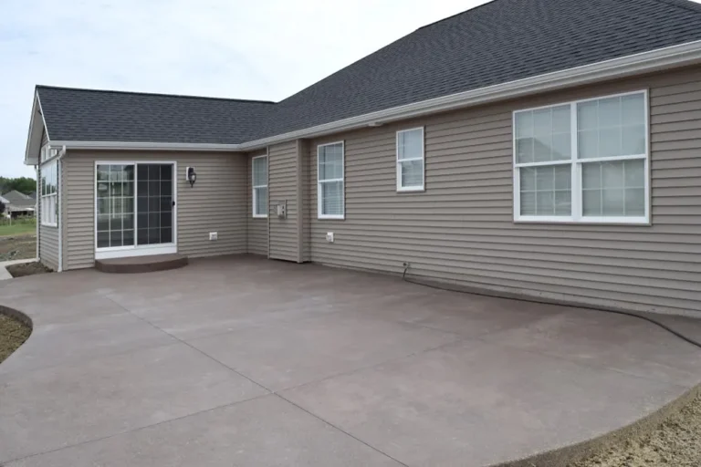 Concrete patio installed in a backyard