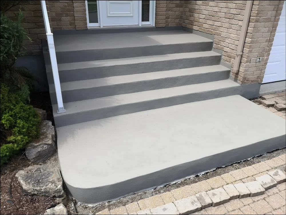 Concrete steps and landing at a home entrance