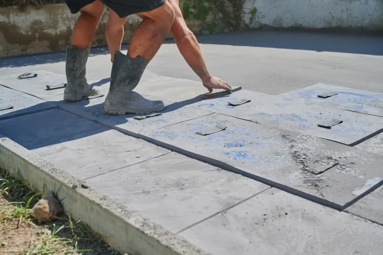 Contractor working on a stamped concrete patio
